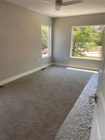 an empty room with windows