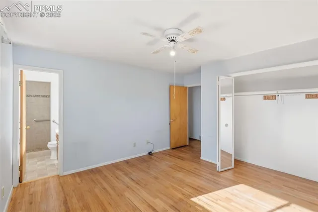 a view of an empty room and wooden floor