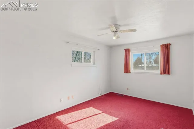 an empty room with windows