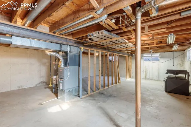 a view of an empty room with wooden walls