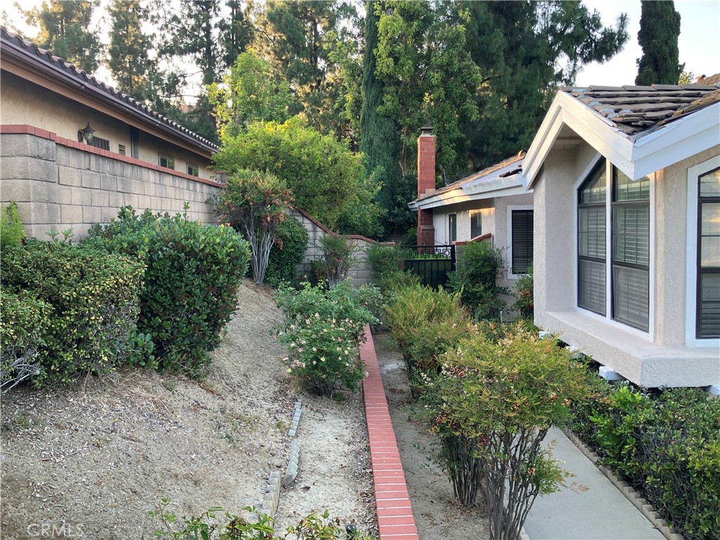 19933 Ralph Street Walnut, CA 91789 - Photo 7 of 77 a view of an house with backyard space and garden