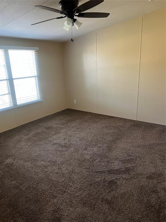 3370 Surfside Drive May, TX 76857 - Photo 19 of 28 an empty room with a ceiling fan and window