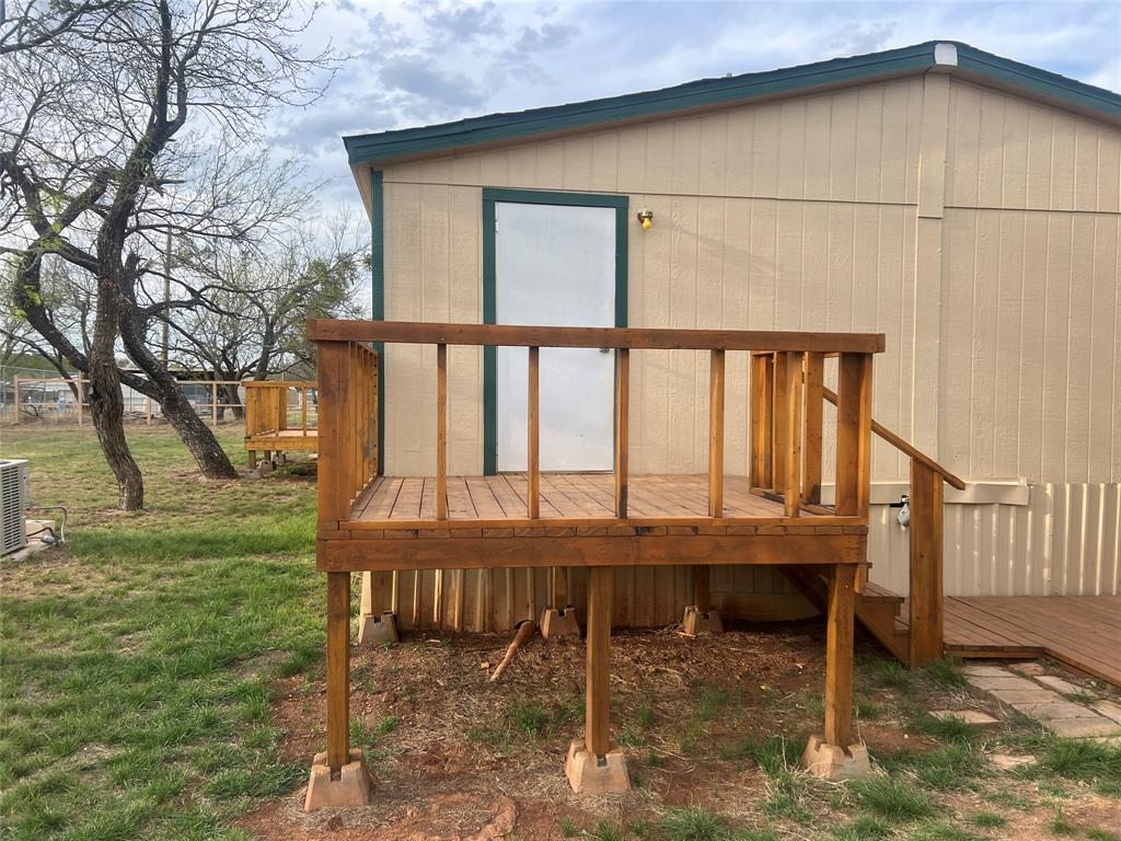 3370 Surfside Drive May, TX 76857 - Photo 26 of 28 a view of a wooden chairs and table in the patio