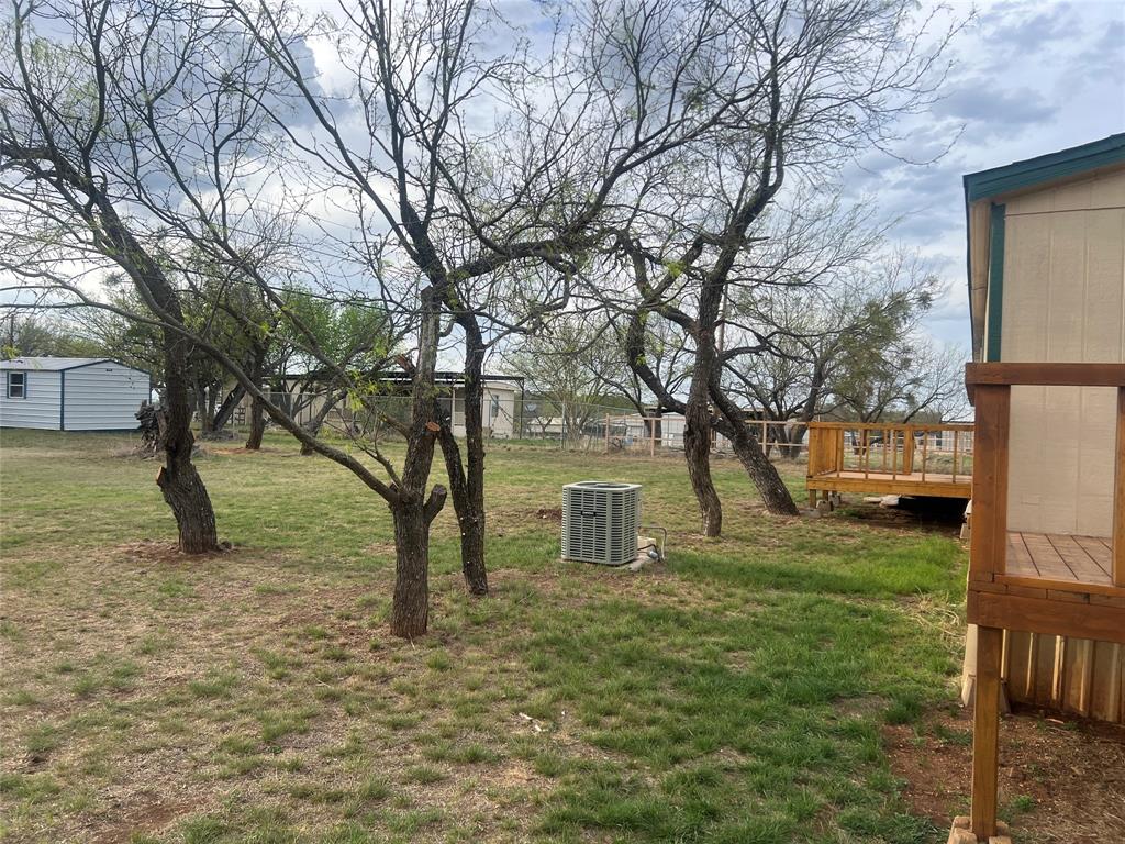 3370 Surfside Drive May, TX 76857 - Photo 27 of 28 a backyard of a house with lots of green space