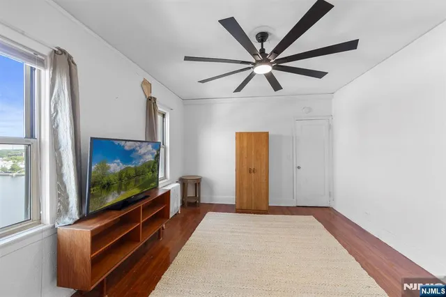 a living room with a flat screen tv
