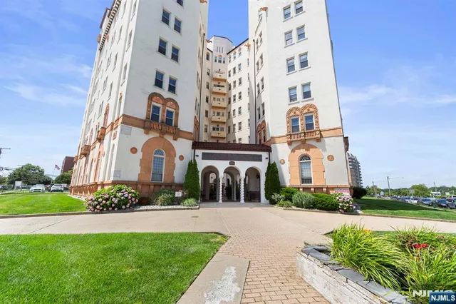 a view of a building next to a yard