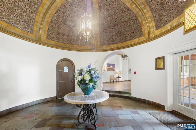a living room with furniture and a clock
