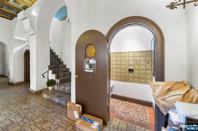 a view of a patio with table and chairs and potted plants