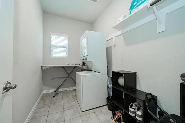a room with a chair and a window