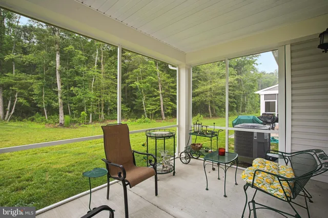 a living room with a yard table and chairs