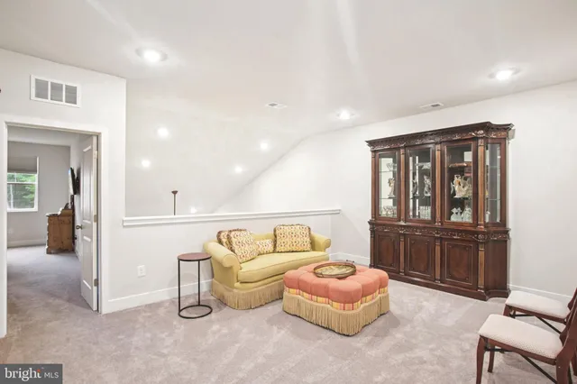 a bedroom with furniture and window