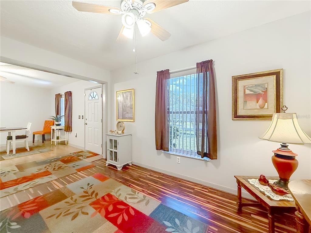 457 North Rooks Avenue Inverness, FL 34453 - Photo 11 of 61 a bedroom with a bed and a chandelier