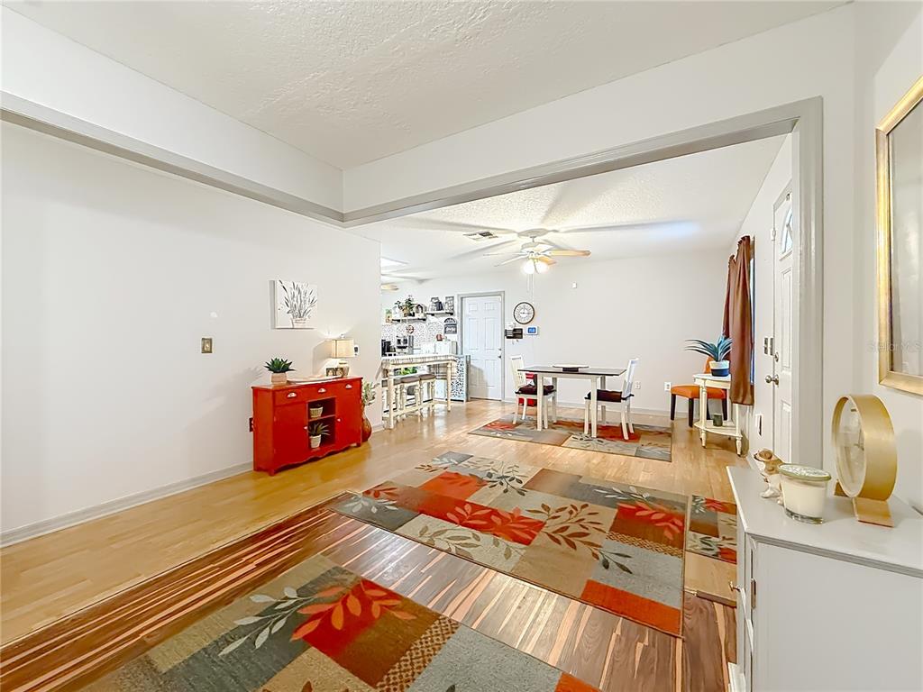 457 North Rooks Avenue Inverness, FL 34453 - Photo 12 of 61 a living room with furniture a rug and a window