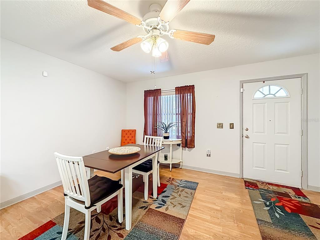 457 North Rooks Avenue Inverness, FL 34453 - Photo 15 of 61 a view of a dining room with furniture and wooden floor