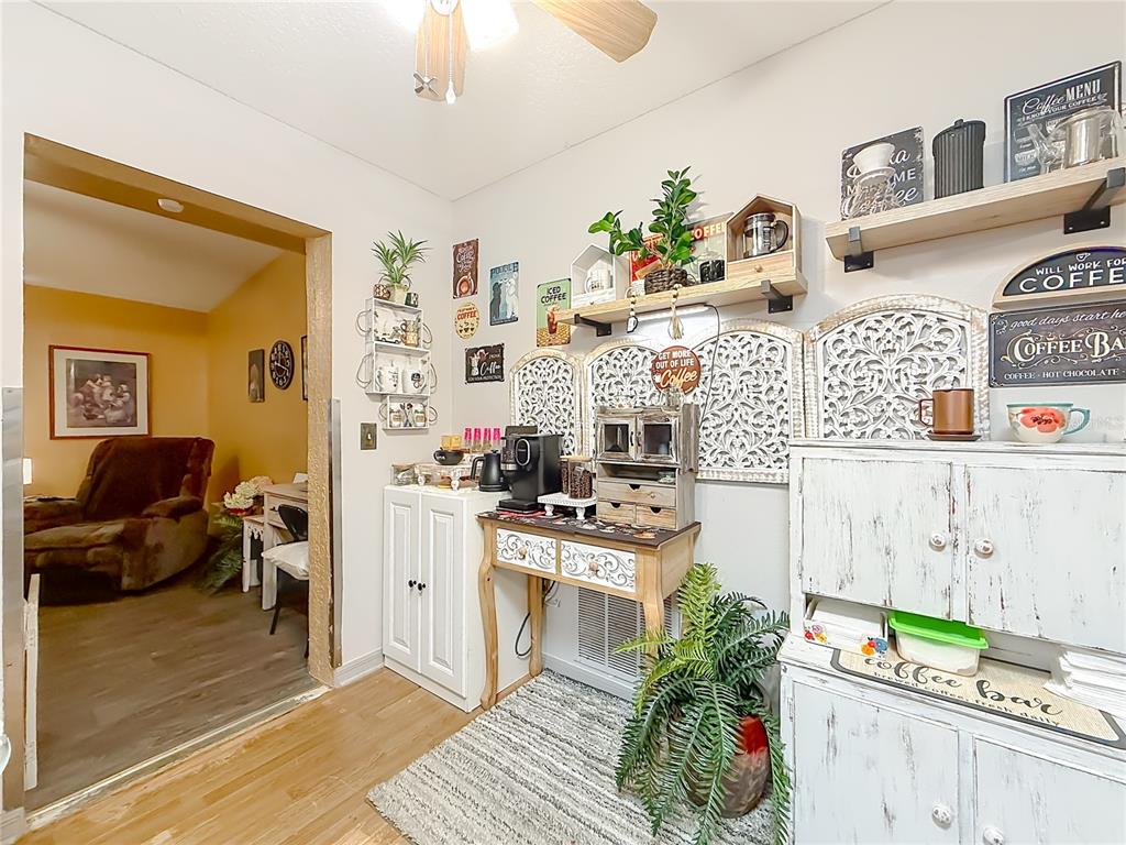 457 North Rooks Avenue Inverness, FL 34453 - Photo 22 of 61 a kitchen with granite countertop lots of clutter and appliances