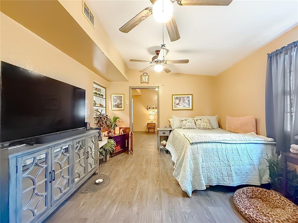 457 North Rooks Avenue Inverness, FL 34453 - Photo 31 of 61 a bedroom with furniture and a flat screen tv