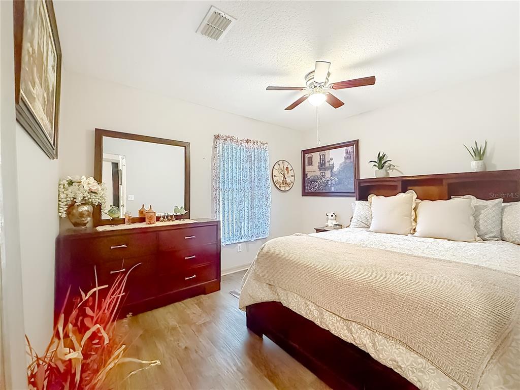 457 North Rooks Avenue Inverness, FL 34453 - Photo 32 of 61 a bedroom with a bed and a dresser