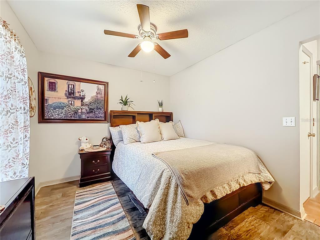 457 North Rooks Avenue Inverness, FL 34453 - Photo 33 of 61 a bedroom with a bed and a painting on the wall