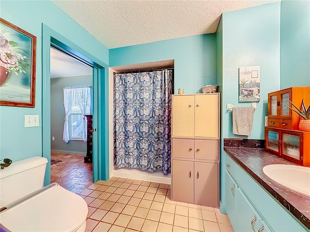 457 North Rooks Avenue Inverness, FL 34453 - Photo 35 of 61 a bathroom with a sink a toilet and shower