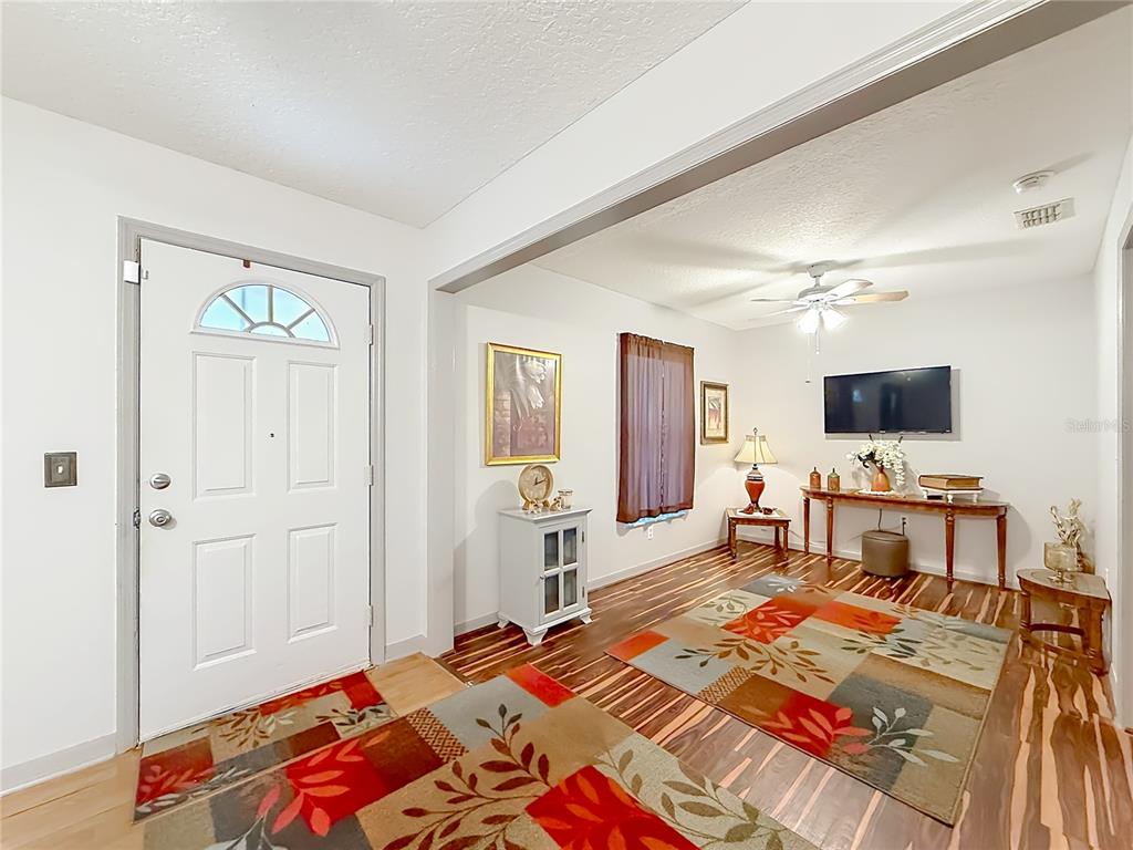 457 North Rooks Avenue Inverness, FL 34453 - Photo 8 of 61 a bedroom with a bed and a flat screen tv