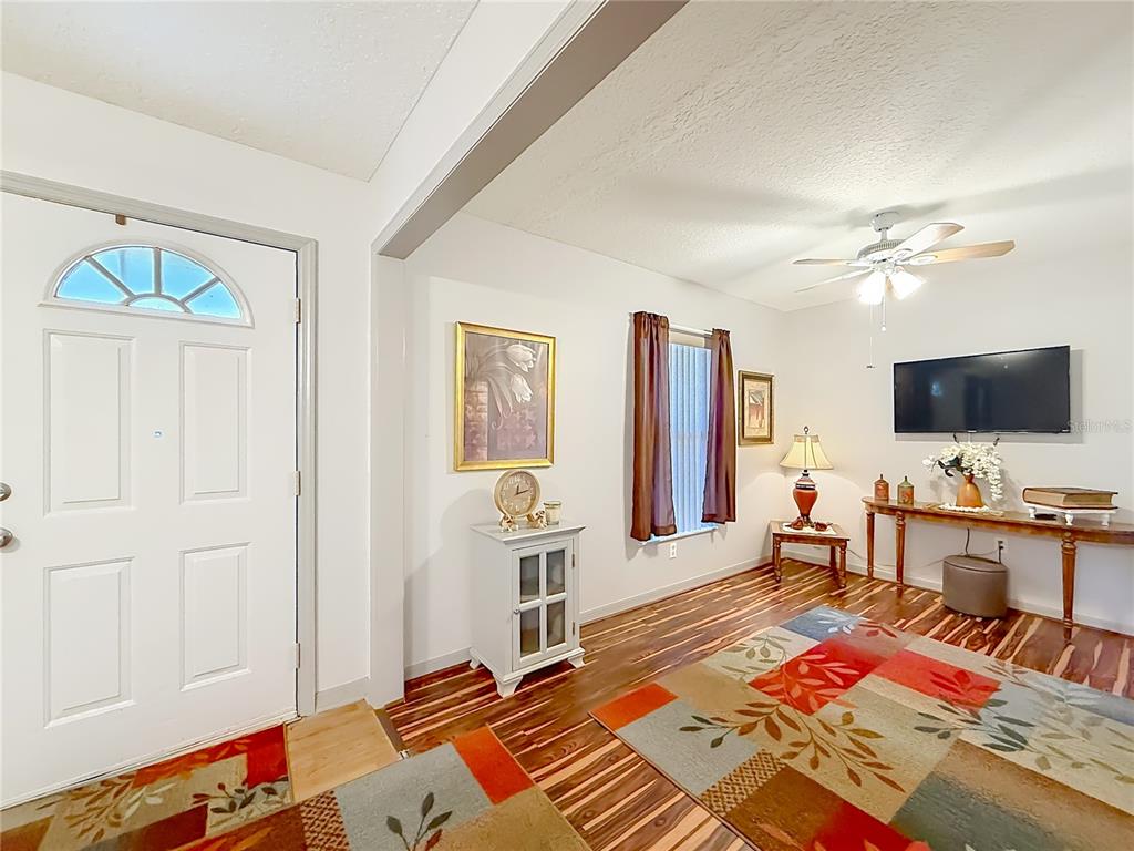 457 North Rooks Avenue Inverness, FL 34453 - Photo 9 of 61 a living room with furniture and a flat screen tv