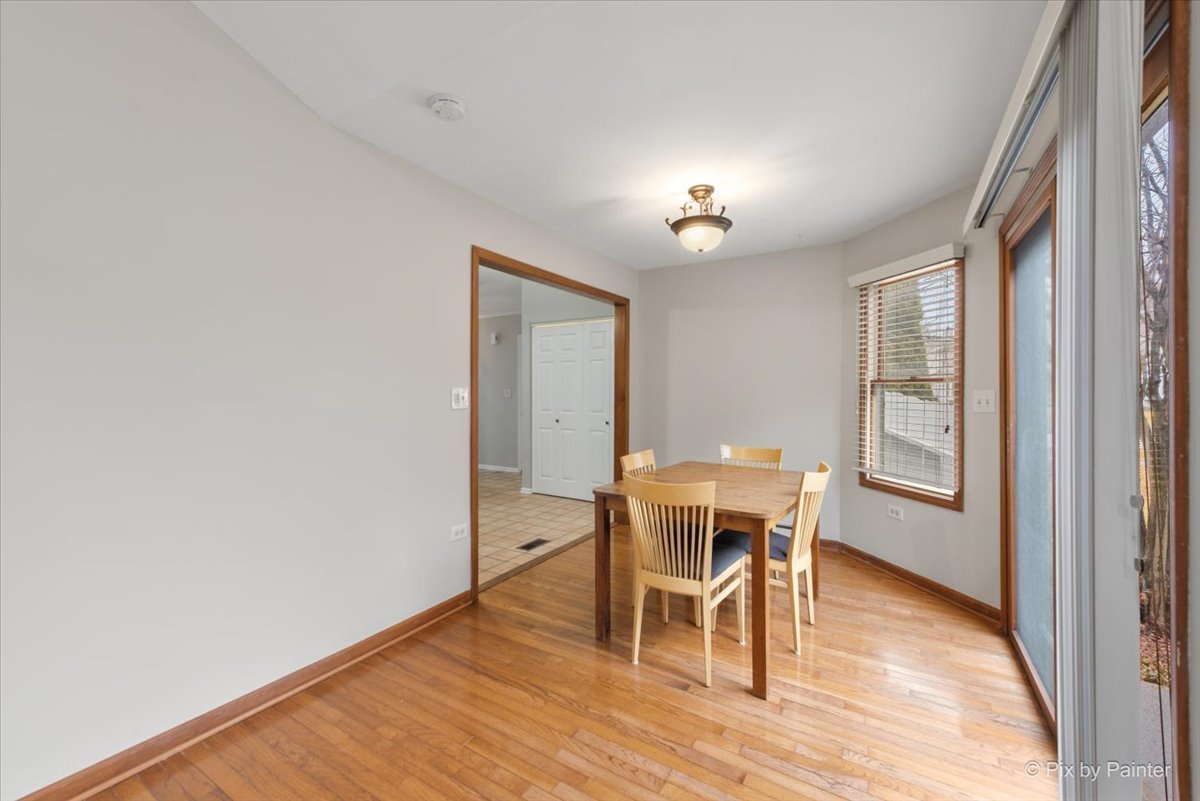 1095 Devonshire Avenue Naperville, IL 60540 - Photo 20 of 48 a view of a dining room with furniture and wooden floor