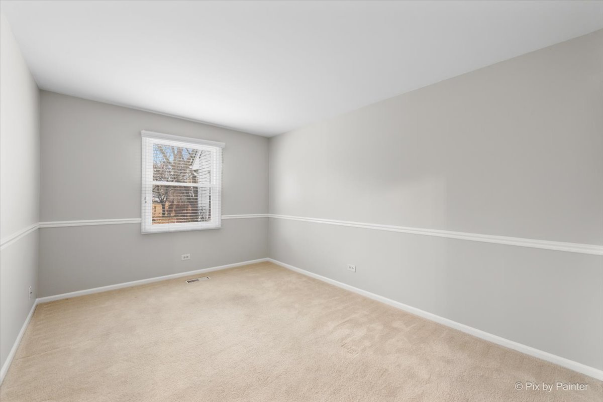 1095 Devonshire Avenue Naperville, IL 60540 - Photo 25 of 48 an empty room with windows