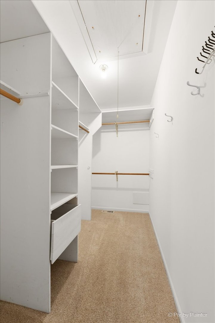 1095 Devonshire Avenue Naperville, IL 60540 - Photo 33 of 48 a view of an empty walk in closet