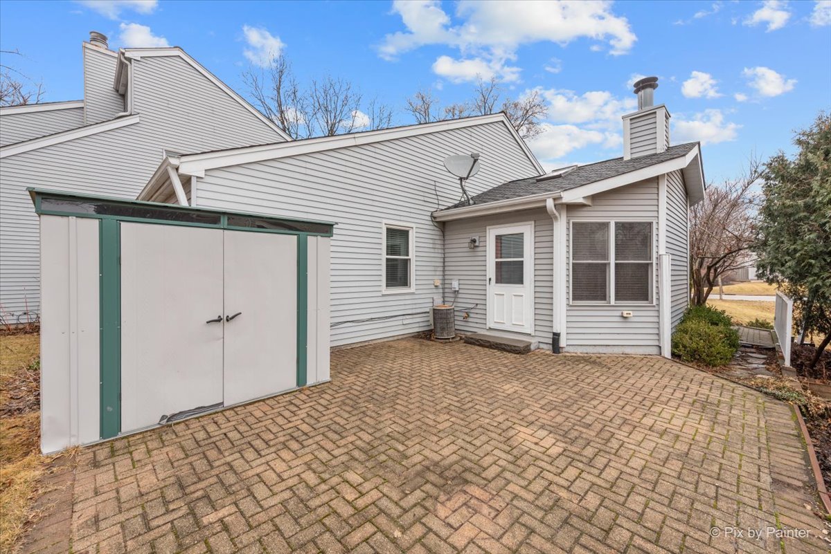 1095 Devonshire Avenue Naperville, IL 60540 - Photo 35 of 48 a view of a house with a backyard