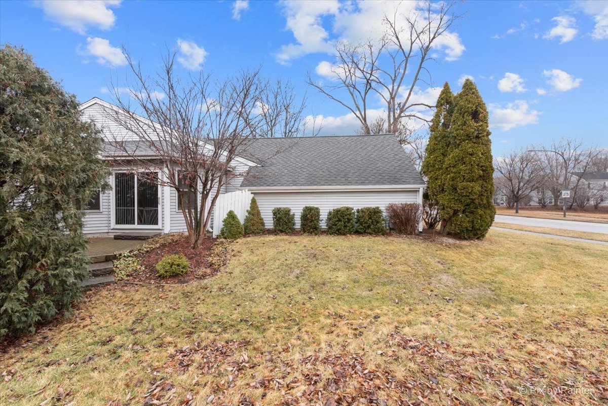 1095 Devonshire Avenue Naperville, IL 60540 - Photo 36 of 48 a front view of a house with a yard