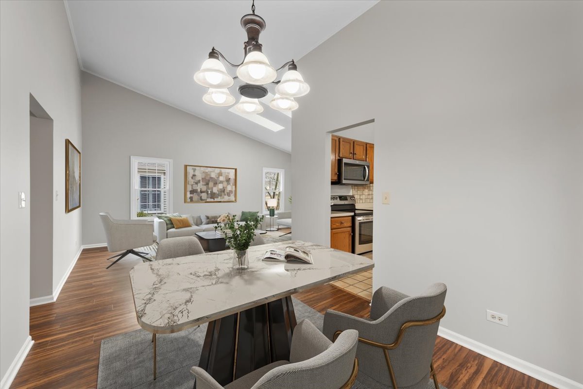 1095 Devonshire Avenue Naperville, IL 60540 - Photo 10 of 48 a view of a dining room with furniture and wooden floor