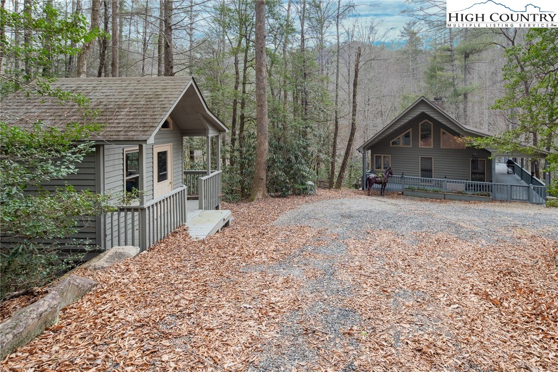 1278 Meadow Road Ferguson, NC 28624 - Photo 2 of 38 a house with a tree in front of it