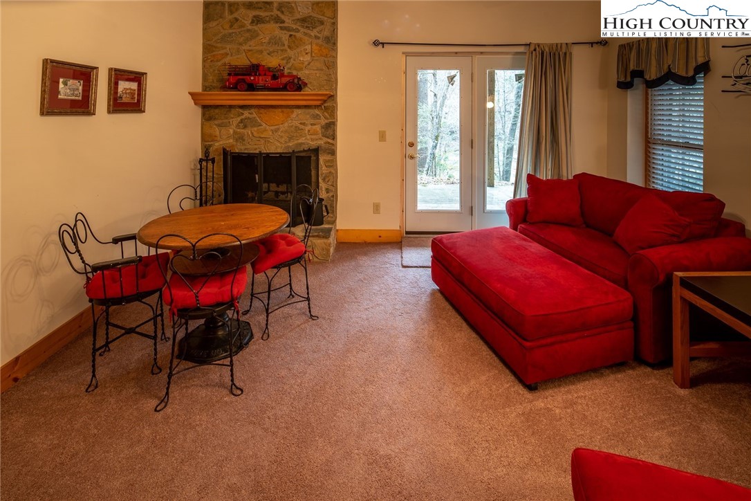 1278 Meadow Road Ferguson, NC 28624 - Photo 21 of 38 a living room with furniture a fireplace and a window