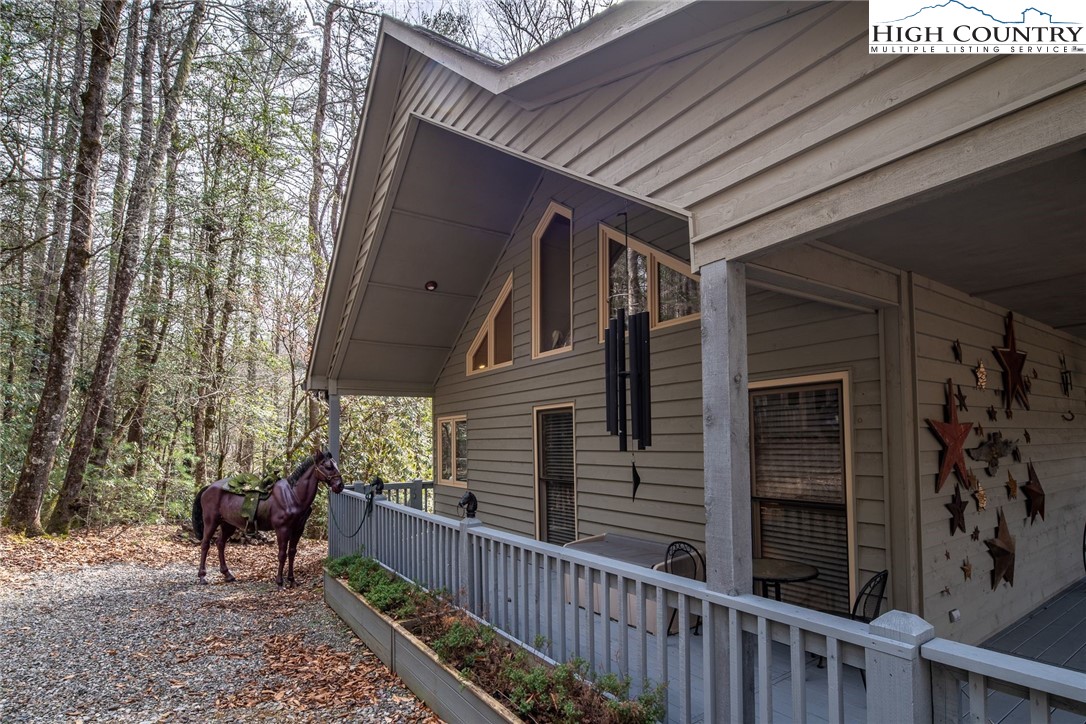 1278 Meadow Road Ferguson, NC 28624 - Photo 34 of 38 a view of a porch with furniture and a tree