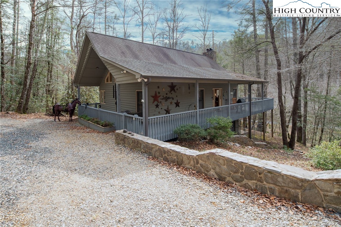 1278 Meadow Road Ferguson, NC 28624 - Photo 35 of 38 a house with trees in the background