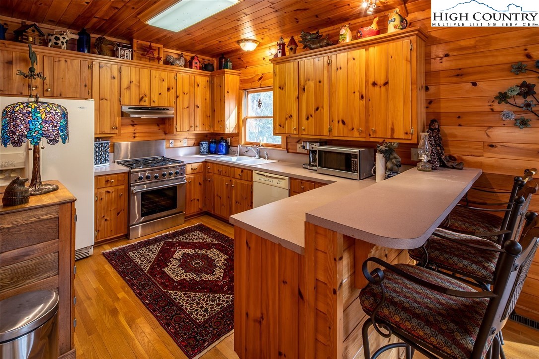 1278 Meadow Road Ferguson, NC 28624 - Photo 8 of 38 a kitchen that has a sink and a stove
