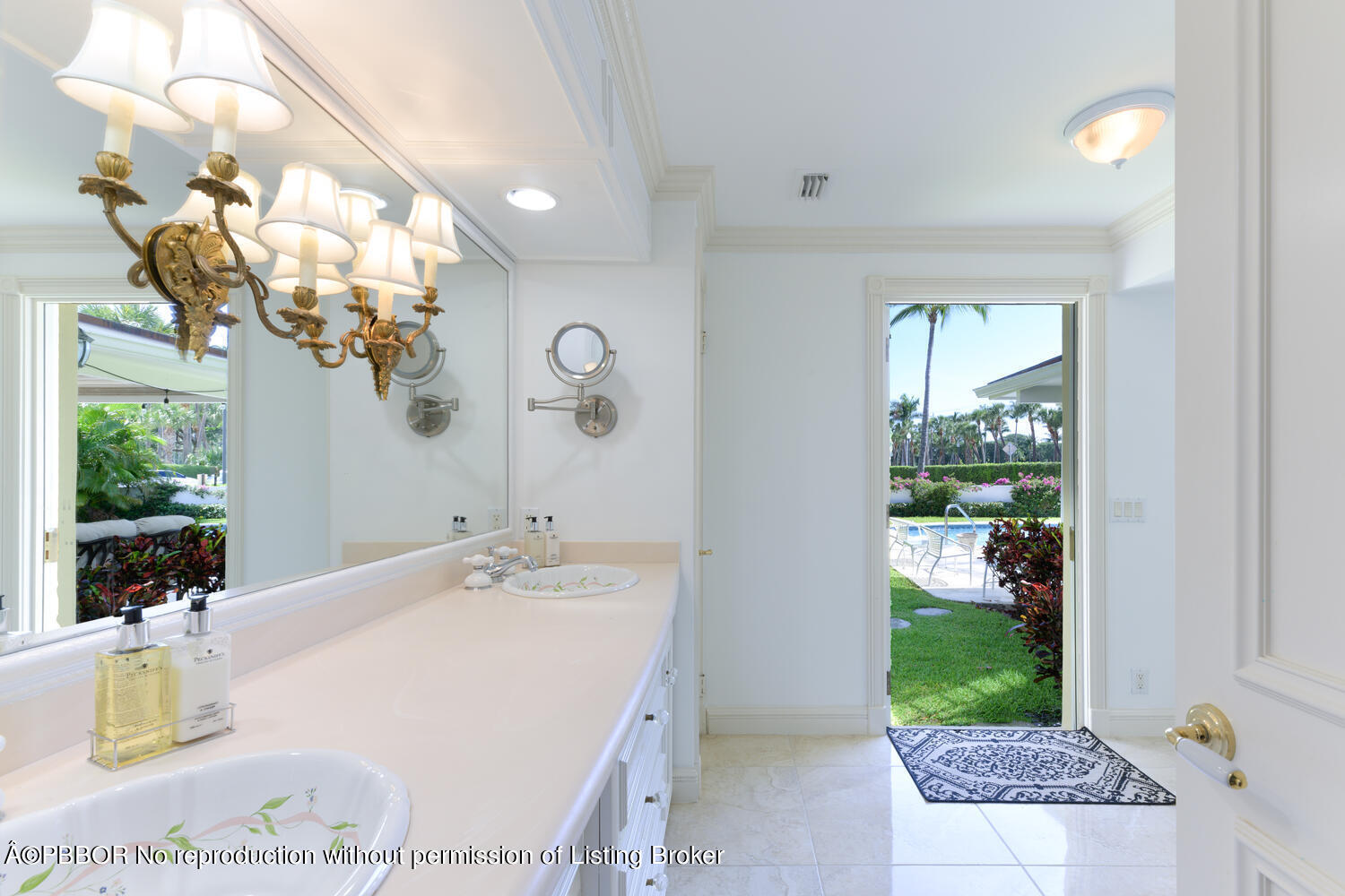 201 Pendleton Avenue Palm Beach, FL 33480 - Photo 11 of 22 a bathroom with a sink a mirror and a shower