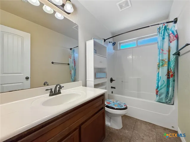 a bathroom with a sink a toilet and a bathtub