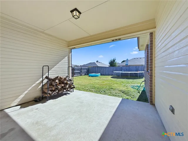 a view of a backyard of the house