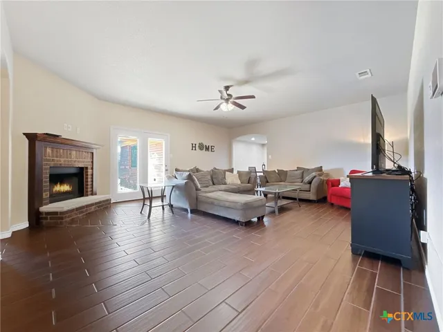a living room with furniture and a fireplace