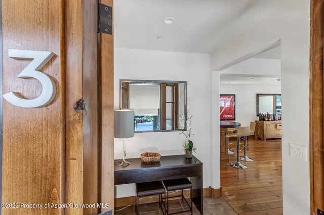 a workspace with furniture and a bathroom