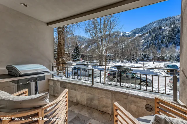 a view of a balcony with chairs