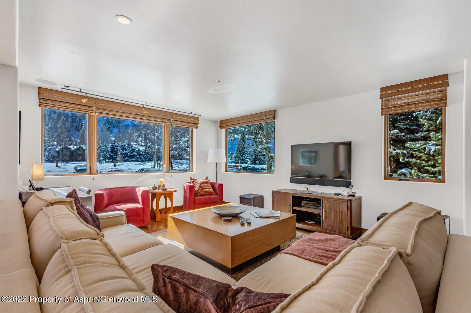 104 West Cooper Avenue, Unit 3 Aspen, CO 81611 - Photo 4 of 14 a living room with furniture large window and a flat screen tv