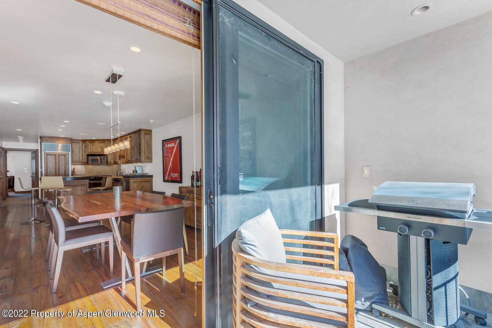 104 West Cooper Avenue, Unit 3 Aspen, CO 81611 - Photo 7 of 14 a dining room with furniture and a rug