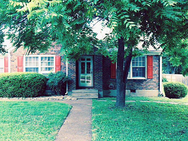 5562 Knob Road Nashville, TN 37209 - Photo 2 of 9 a front view of a house with garden