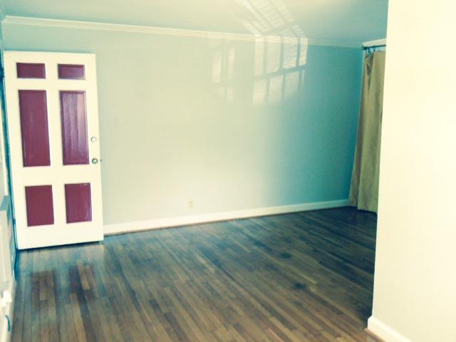 5562 Knob Road Nashville, TN 37209 - Photo 3 of 9 a view of an empty room with wooden floor and a window