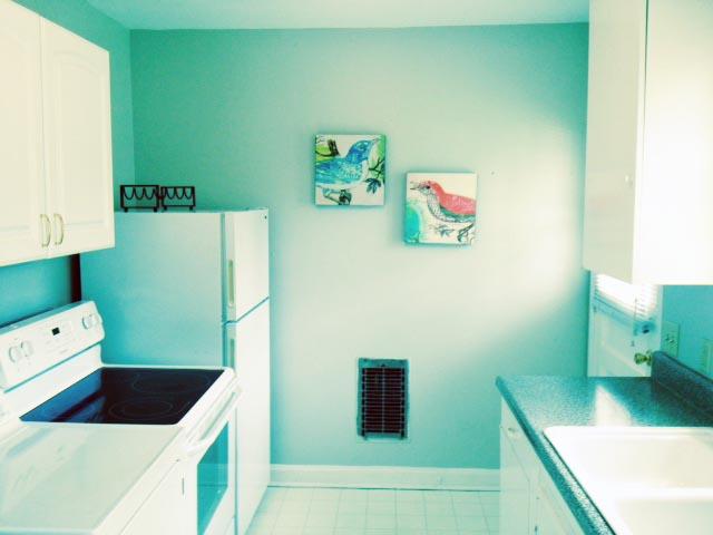 5562 Knob Road Nashville, TN 37209 - Photo 4 of 9 a room with a refrigerator and a sink