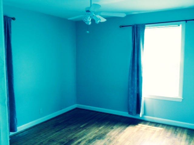 5562 Knob Road Nashville, TN 37209 - Photo 6 of 9 an empty room with wooden floor and windows