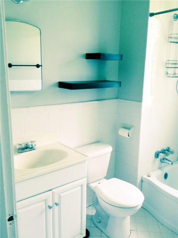 5562 Knob Road Nashville, TN 37209 - Photo 7 of 9 a bathroom with a sink and a toilet