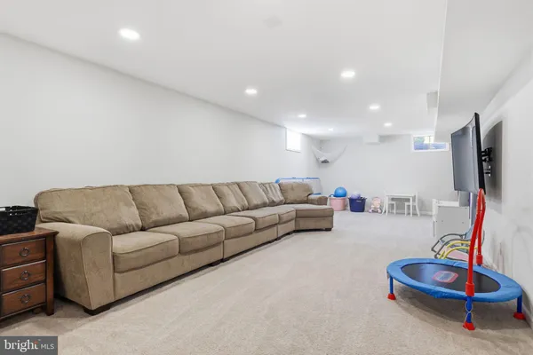 a view of a livingroom with furniture and a flat screen tv